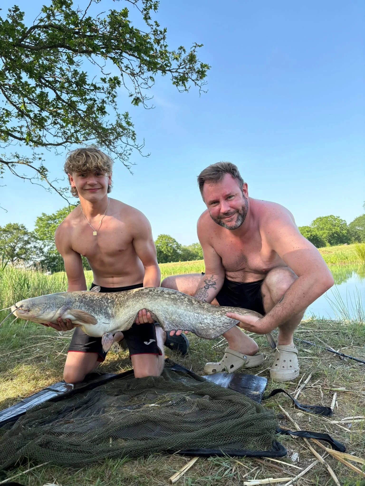 Two men with a fish