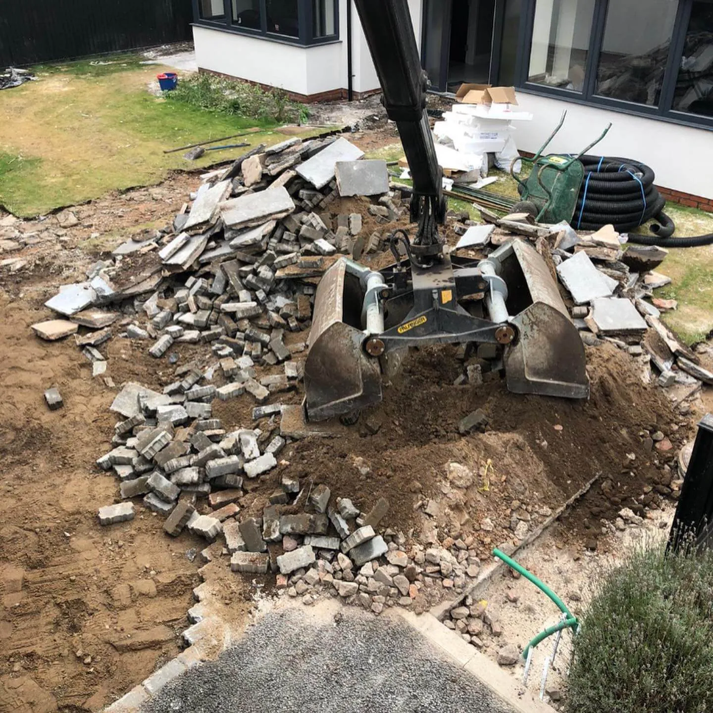 A pile of rubble next to a building.