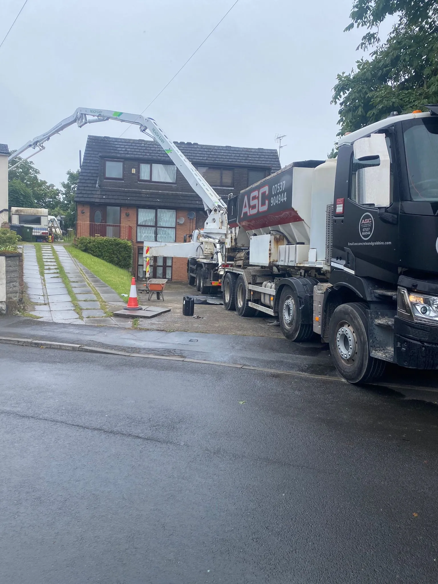 concrete mixer laying down the field