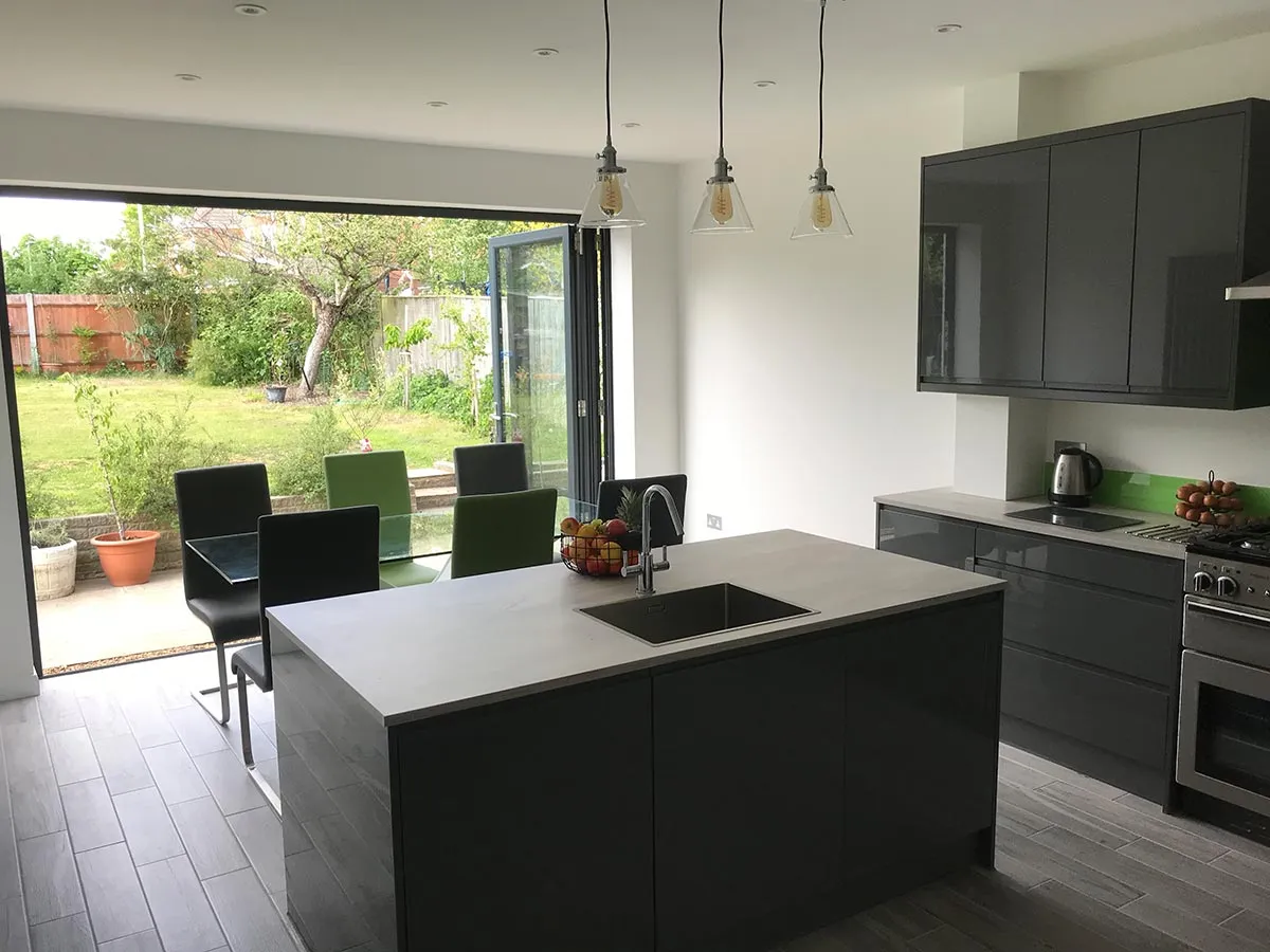 a kitchen with a large island and a stove top oven