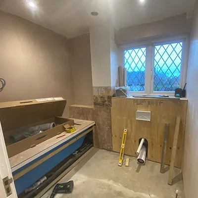 A room that is being remodeled with a window.