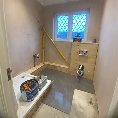 A room with a sink and a window in it.