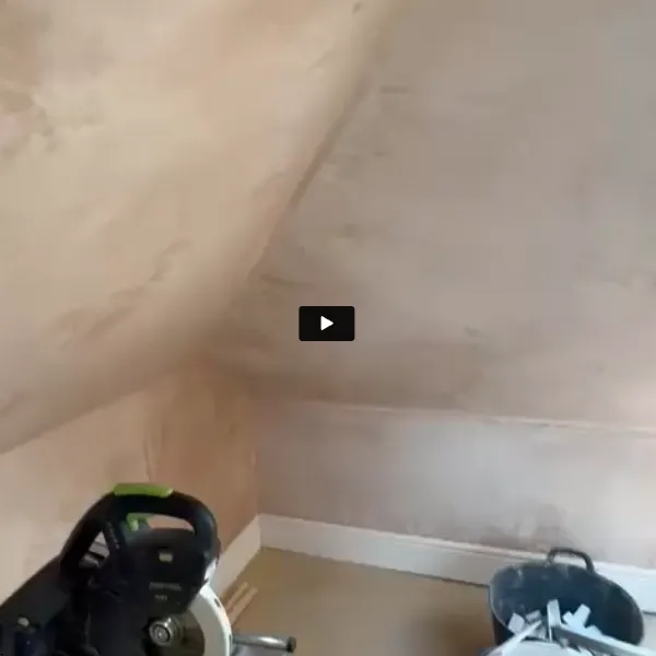 A baby stroller sitting in a corner of a room.