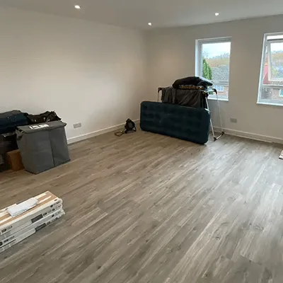 A living room with hard wood floors and hard wood flooring.