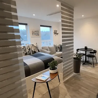 A living room filled with furniture and a flat screen tv.
