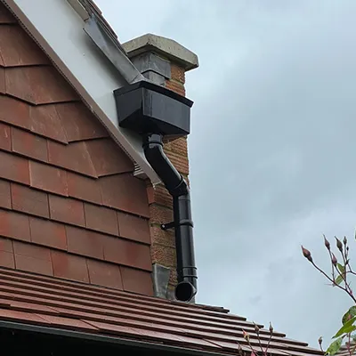 A gutter gutter on the roof of a house.