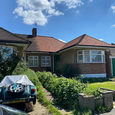 A car is parked in front of a house.