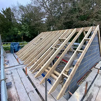 A house being built on top of a wooden deck.