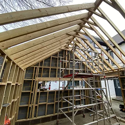 A house being built with wooden framing.
