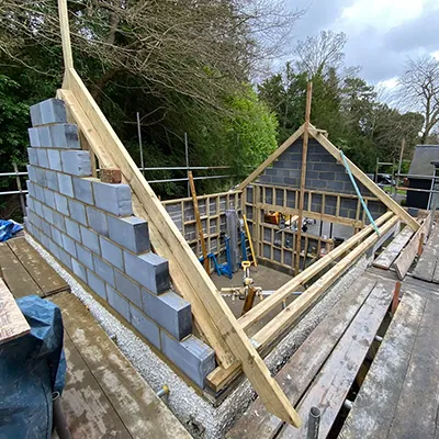 A house being built on top of a wooden deck.