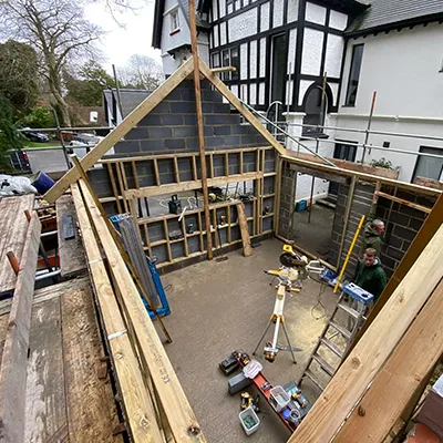 A house being built with wooden framing.
