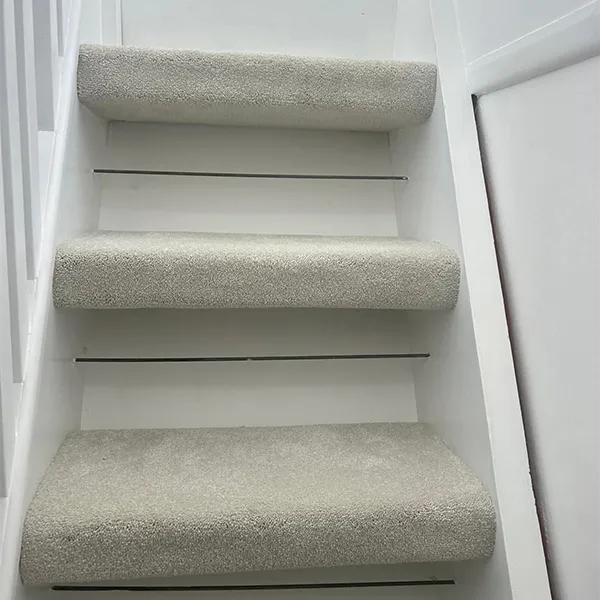 A set of stairs leading up to a door.