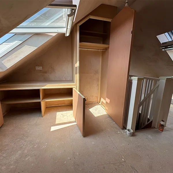 A room that has some shelves in it.