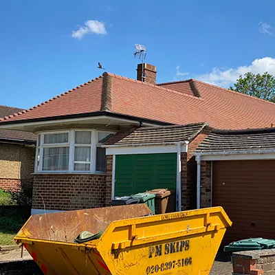 A dump truck parked in front of a house.