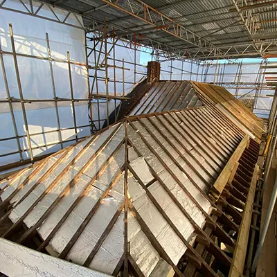 A large metal structure with scaffolding around it.
