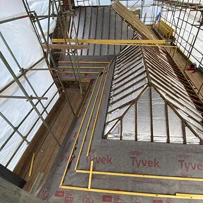 A picture of a building being constructed with scaffolding.