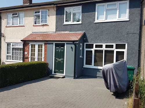 a house with a car parked in front of it