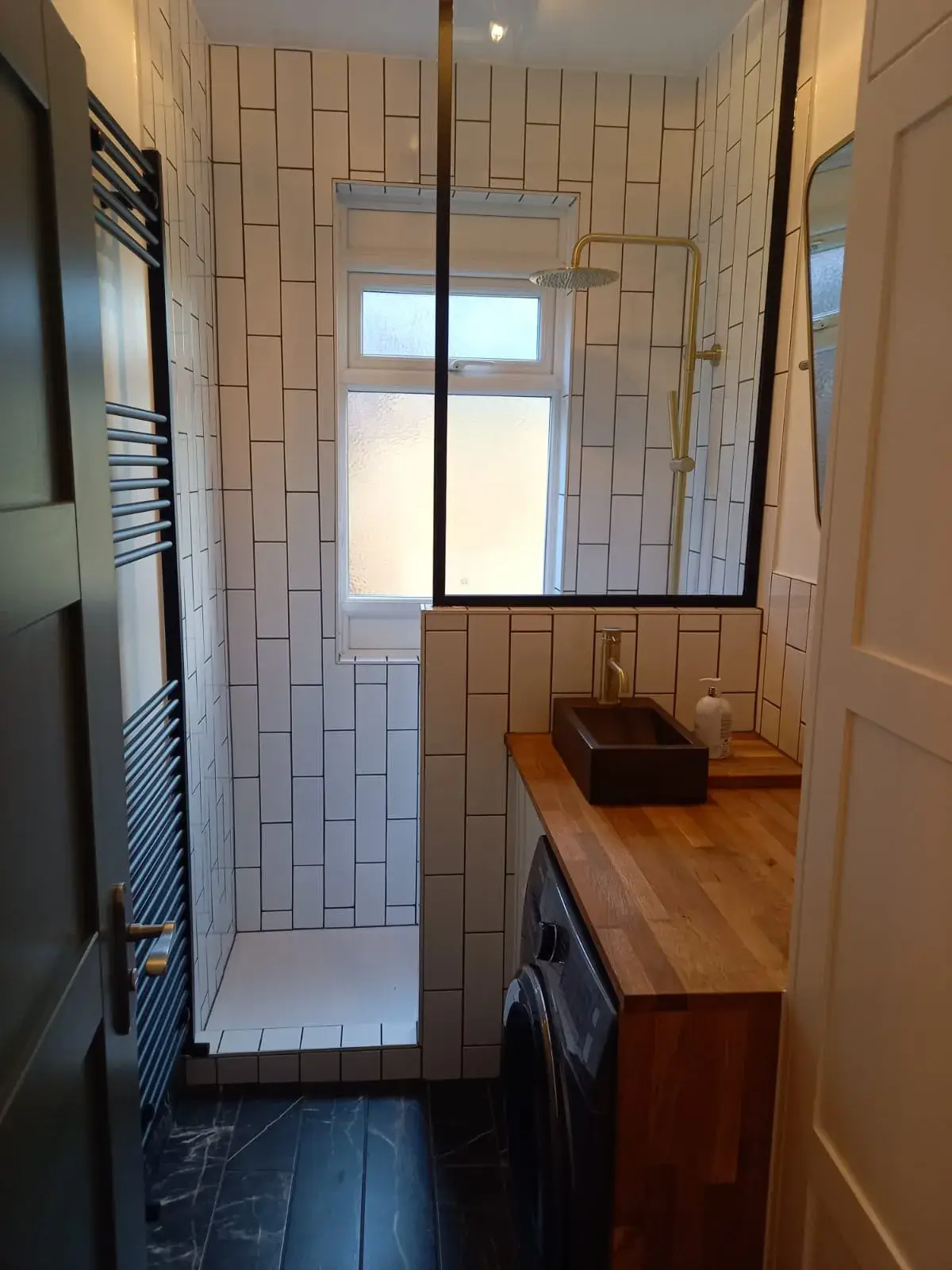 a washer and dryer in a small bathroom