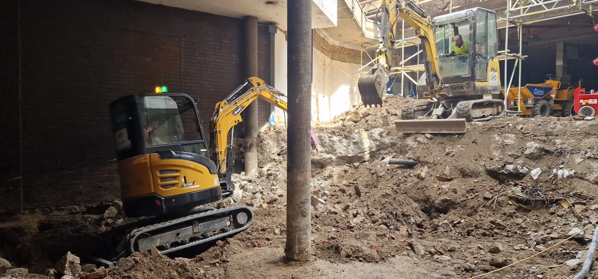 A bulldozer digging through a construction site.