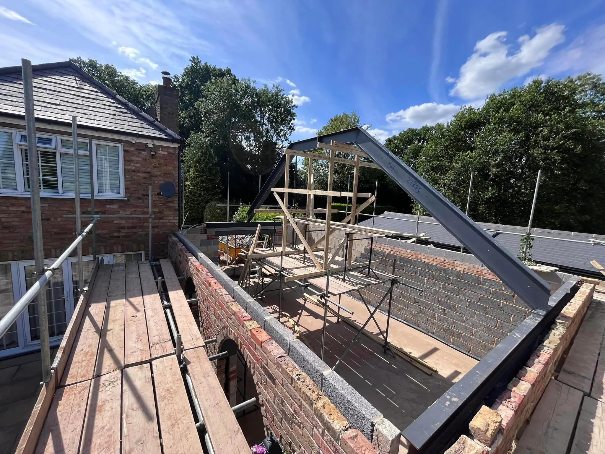 a view of a roof with a metal frame and a skylight