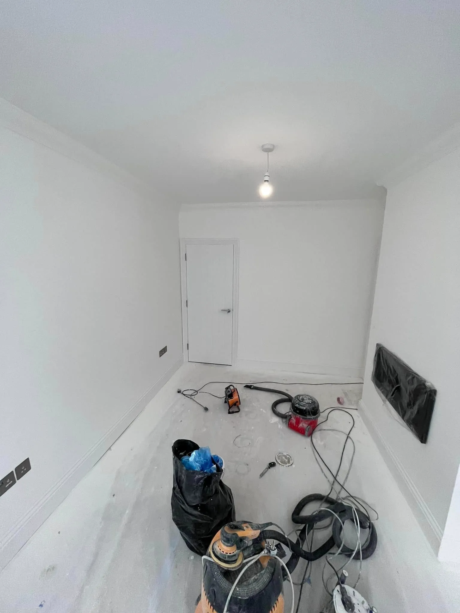 A room that has a bunch of items on the floor.