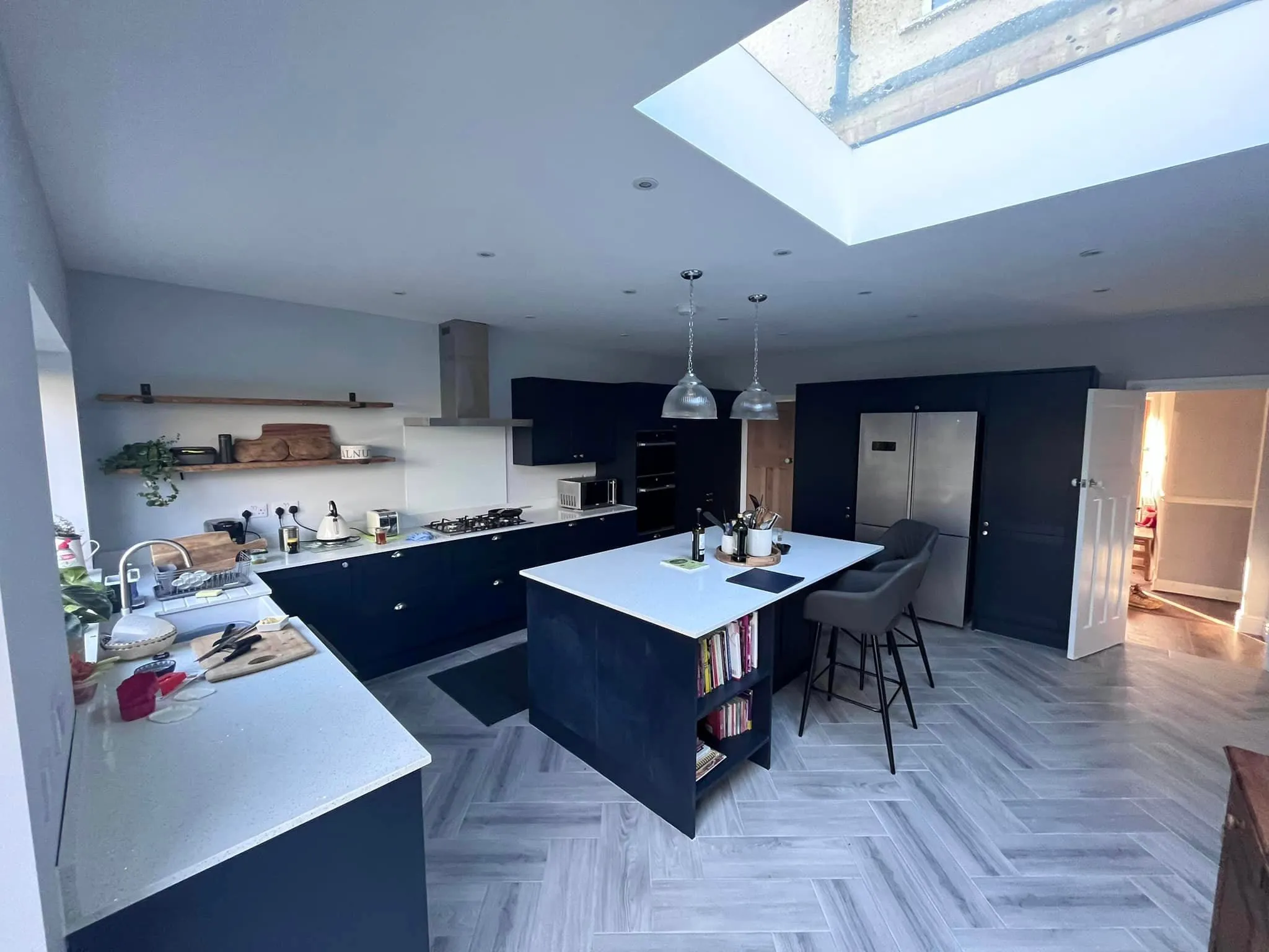 there is a kitchen with a center island and a skylight
