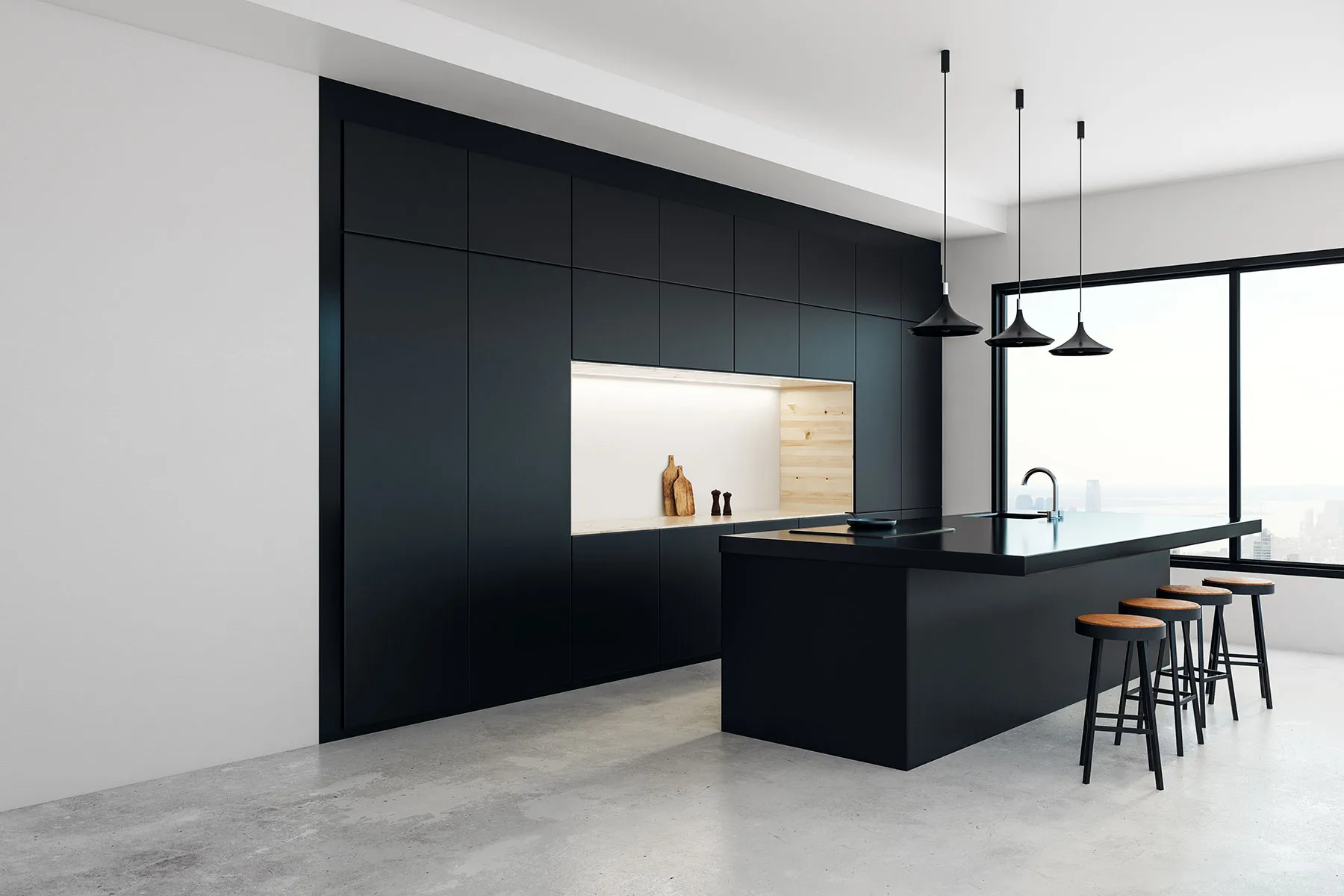 A modern kitchen with black cabinets and stools.